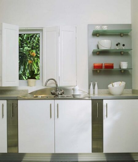 white kitchen with half open solid shutters