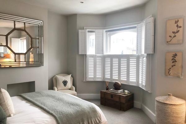 example of tier on tier MDF shutters in a bedroom