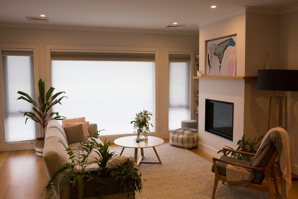 lounge with large windows and honeycomb blind as window dressing